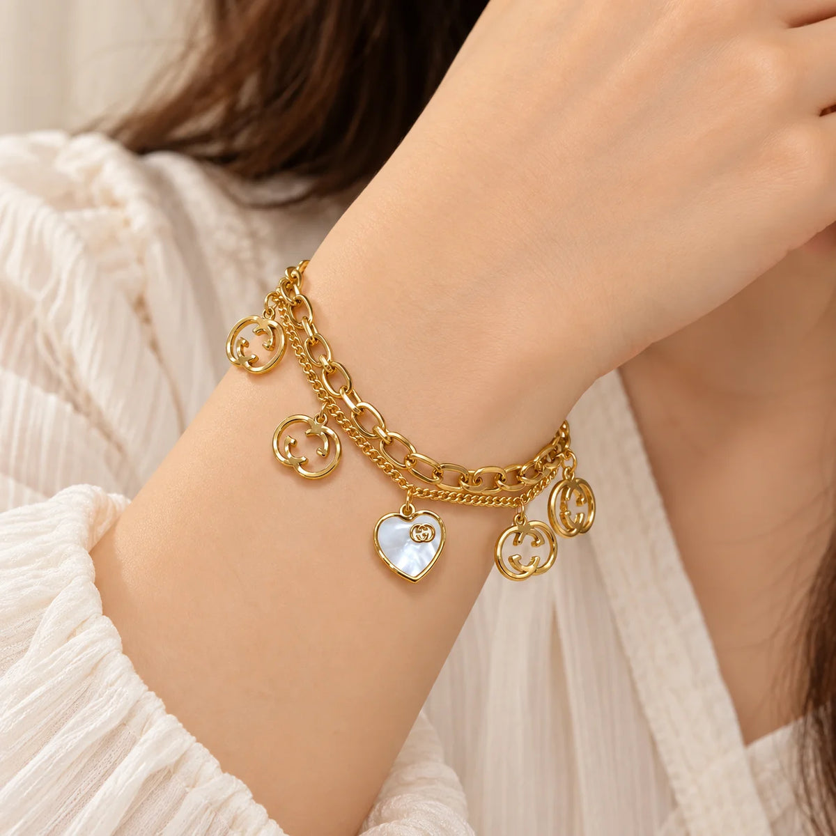 White Heart Medallion Two-Layer Gold Charm Bracelet